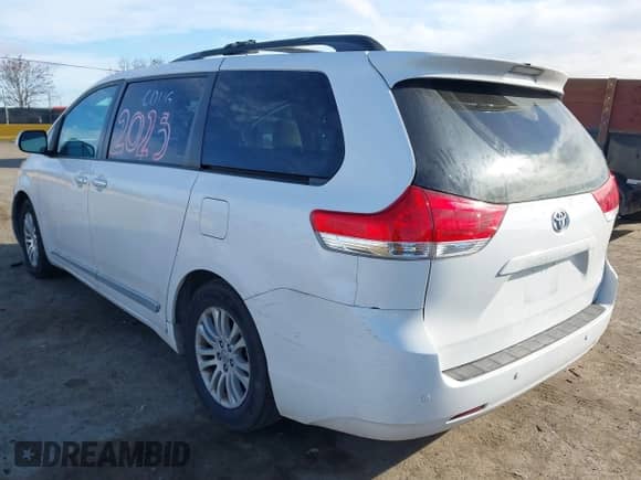 2013 Toyota Sienna XLE AAS with VIN 5TDYK3DC8DS324853, listed as a IAAI auction lot 41647704 with 143,656 mi miles and . Bid and sale history available at DreamBid. Image 3.