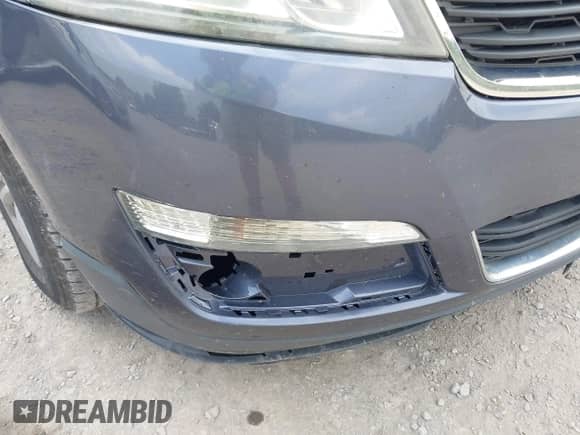 2014 Chevrolet Traverse LS z VIN 1GNKVFKD5EJ281220, wystawiony jako IAAI lot #42947918 z przebiegiem Nie podano mil oraz . Historia ofert i sprzedaży dostępna na DreamBid. Obrazek 6.