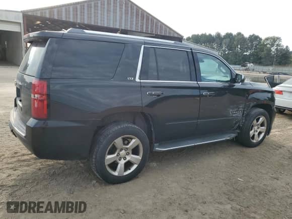 2015 Chevrolet Tahoe LTZ with VIN 1GNSCCKC9FR636937, listed as a Copart auction lot 81036145 with 101,034 mi miles and Salvage title. Bid and sale history available at DreamBid. Image 3.