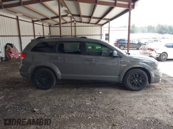 2020 Dodge Journey SE Value with VIN 3C4PDCABXLT259669, listed as a IAAI auction lot 42995598 with 98,957 mi miles and . Bid and sale history available at DreamBid. Image 13.