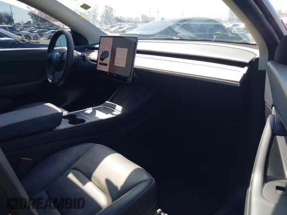 2022 Tesla Model Y Performance with VIN 7SAYGDEF7NF516418, listed as a IAAI auction lot 43222998 with 26,525 mi miles and . Bid and sale history available at DreamBid. Image 5.