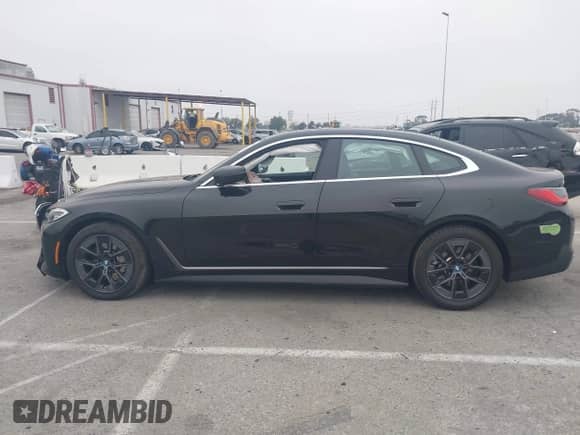 2023 BMW i4 eDrive35 with VIN WBY43AW04PFP93864, listed as a IAAI auction lot 42409885 with 19,758 mi miles and . Bid and sale history available at DreamBid. Image 14.