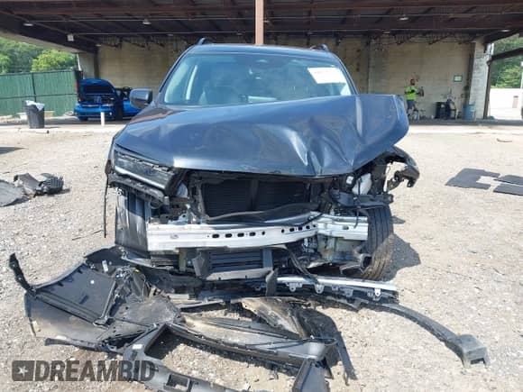 2024 Honda Pilot Touring with VIN 5FNYG1H77RB024994, listed as a IAAI auction lot 42672752 with 23,740 mi miles and . Bid and sale history available at DreamBid. Image 12.