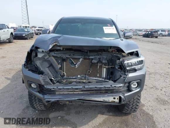 2023 Toyota Tacoma SR z VIN 3TMCZ5AN4PM571394, wystawiony jako IAAI lot #43129720 z przebiegiem 44 374 mil mil oraz . Historia ofert i sprzedaży dostępna na DreamBid. Obrazek 13.