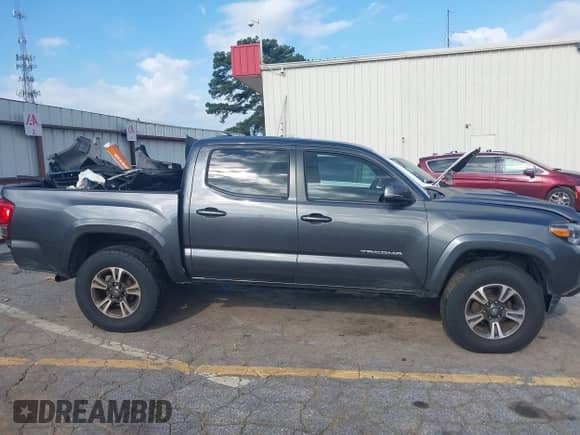 2017 Toyota Tacoma SR5 with VIN 3TMCZ5AN7HM115200, listed as a IAAI auction lot 43115086 with 117,000 mi miles and . Bid and sale history available at DreamBid. Image 14.