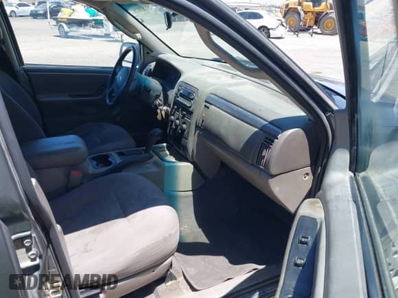 2003 Jeep Grand Cherokee Laredo z VIN 1J4GX48S03C609724, wystawiony jako IAAI lot #42783828 z przebiegiem 226 965 mil mil oraz . Historia ofert i sprzedaży dostępna na DreamBid. Obrazek 5.