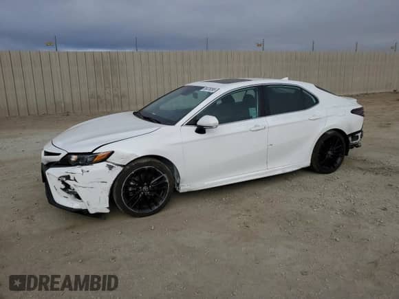 2023 Toyota Camry Hybrid SE with VIN 4T1S31AK0PU046562, listed as a Copart auction lot 69478395 with 84,935 mi miles and Salvage title. Bid and sale history available at DreamBid. Image 1.