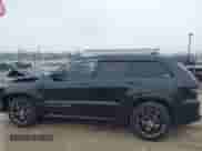 2015 Jeep Grand Cherokee SRT z VIN 1C4RJFDJ4FC613076, wystawiony jako IAAI lot #41732272 z przebiegiem 152 538 mil mil oraz . Historia ofert i sprzedaży dostępna na DreamBid. Obrazek 14.