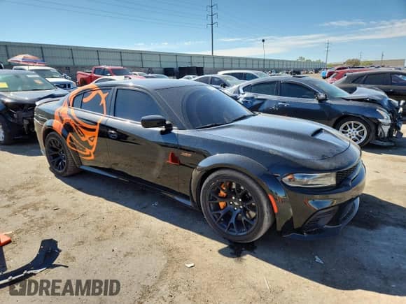 2023 Dodge Charger Scat Pack with VIN 2C3CDXGJ3PH508823, listed as a Copart auction lot 67311025 with 53,871 mi miles and Salvage title. Bid and sale history available at DreamBid. Image 4.