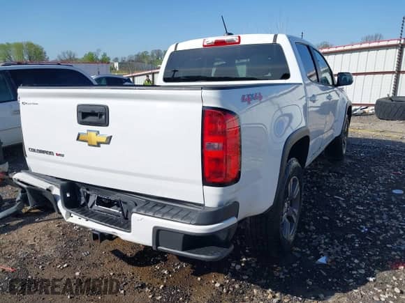 2018 Chevrolet Colorado 4WD Work Truck z VIN 1GCGTBEN1J1109892, wystawiony jako IAAI lot #41990388 z przebiegiem 100 767 mil mil oraz . Historia ofert i sprzedaży dostępna na DreamBid. Obrazek 4.