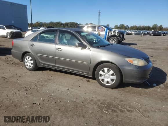 2002 Toyota Camry LE с VIN 4T1BE32K02U573319, выставлен на аукционе Copart как лот 87076145 с пробегом 121 719 миль миль и Списание • Salvage title. История ставок и продаж доступна на DreamBid. Изображение 4.