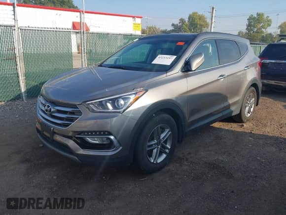 2018 Hyundai Santa Fe 2.4L with VIN 5XYZUDLB0JG570723, listed as a IAAI auction lot 43233197 with 81,248 mi miles and . Bid and sale history available at DreamBid. Image 2.