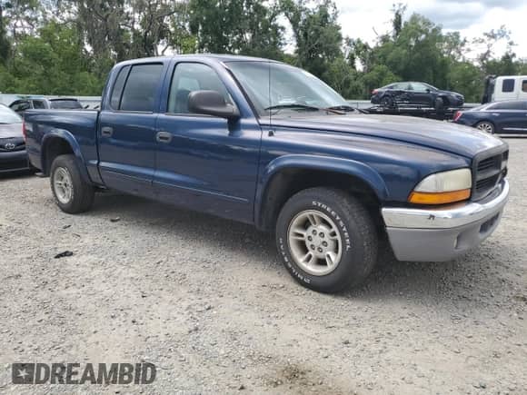 2001 Dodge Dakota Sport с VIN 1B7GL2ANX1S112824, выставлен на аукционе Copart как лот 59379065 с пробегом 315 361 миль миль и Списание • Salvage title. История ставок и продаж доступна на DreamBid. Изображение 4.