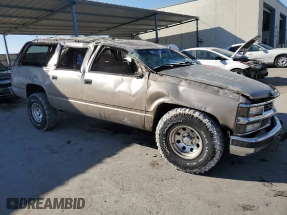 1994 Chevrolet Suburban with VIN 1GNEC16K0RJ411599, listed as a Copart auction lot 73436004 with 273,785 mi miles and Salvage title. Bid and sale history available at DreamBid. Image 4.