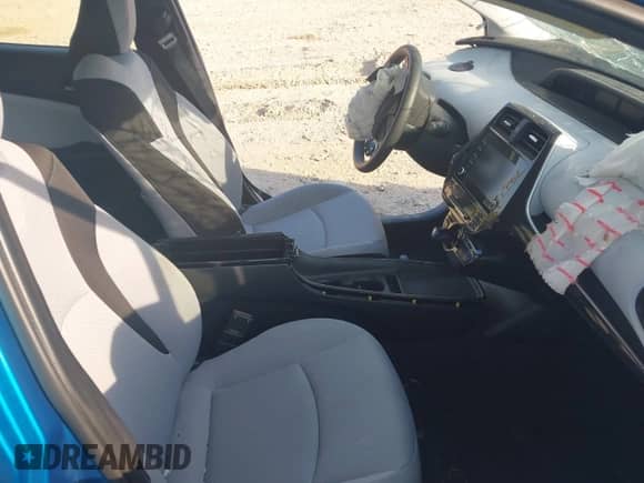 2021 Toyota Prius L Eco with VIN JTDKAMFU1M3136133, listed as a IAAI auction lot 43285926 with 49,911 mi miles and . Bid and sale history available at DreamBid. Image 5.