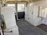 2003 Ford Econoline Cargo с VIN 1FTRE14203HB16427, выставлен на аукционе Copart как лот 70927765 с пробегом 194 552 миль миль и Чистый • Clean title. История ставок и продаж доступна на DreamBid. Изображение 6.