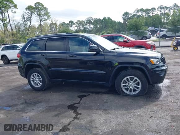 2020 Jeep Grand Cherokee Laredo E with VIN 1C4RJEAG7LC246477, listed as a IAAI auction lot 43113752 with 26,198 mi miles and . Bid and sale history available at DreamBid. Image 13.