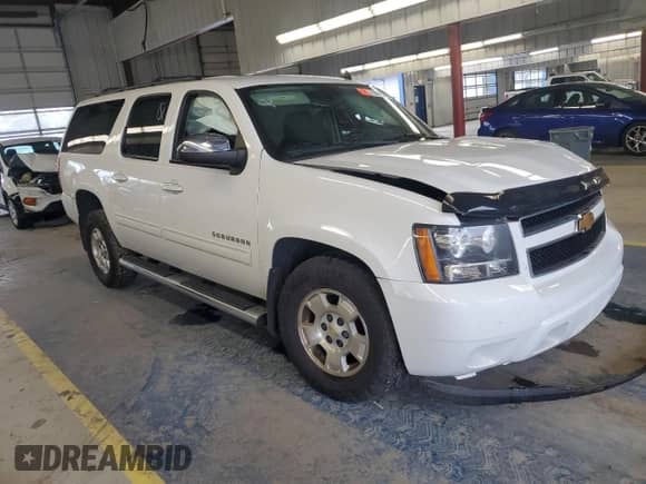 2012 Chevrolet Suburban LS with VIN 1GNSCHE01CR282471, listed as a Copart auction lot 70658295 with Not provided miles and Salvage title. Bid and sale history available at DreamBid. Image 4.