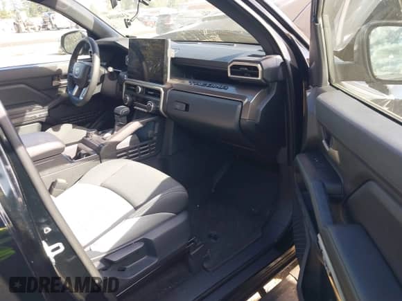 2024 Toyota Tacoma SR5 with VIN 3TMLB5JN4RM080833, listed as a IAAI auction lot 43404104 with 19,266 mi miles and . Bid and sale history available at DreamBid. Image 5.
