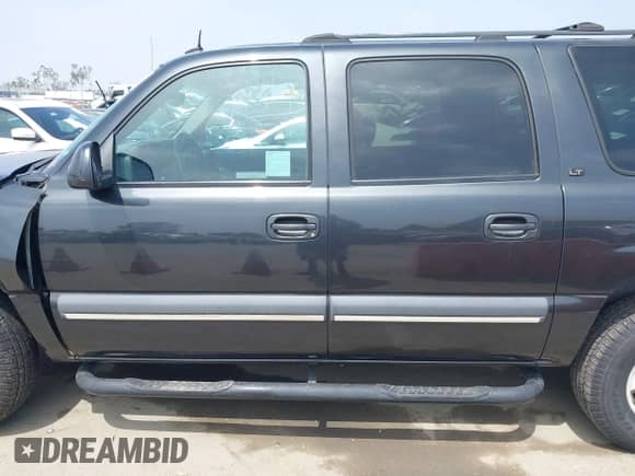 2003 Chevrolet Suburban LS z VIN 3GNEC16TX3G243519, wystawiony jako IAAI lot #42451637 z przebiegiem 133 806 mil mil oraz . Historia ofert i sprzedaży dostępna na DreamBid. Obrazek 14.