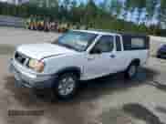 1998 Nissan Frontier XE with VIN 1N6DD26S5WC311065, listed as a Copart auction lot 84643135 with 212,985 mi miles and Salvage title. Bid and sale history available at DreamBid. Image 1.