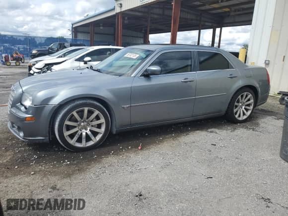 2006 Chrysler 300 C SRT-8 with VIN 2C3LA73W16H423780, listed as a Copart auction lot 56702105 with 93,826 mi miles and Salvage title. Bid and sale history available at DreamBid. Image 1.