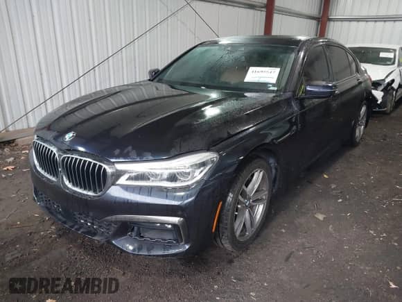 2016 BMW 7 Series 750i xDrive with VIN WBA7F2C50GG418511, listed as a IAAI auction lot 41695547 with 98,858 mi miles and . Bid and sale history available at DreamBid. Image 2.