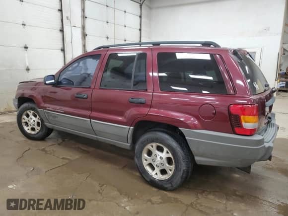 2002 Jeep Grand Cherokee Sport with VIN 1J4GW38S52C272382, listed as a Copart auction lot 65164915 with 248,964 mi miles and Clean title. Bid and sale history available at DreamBid. Image 2.
