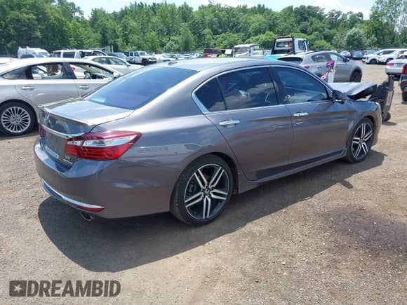 2017 Honda Accord Touring with VIN 1HGCR3F94HA002173, listed as a IAAI auction lot 42673267 with 147,086 mi miles and . Bid and sale history available at DreamBid. Image 4.