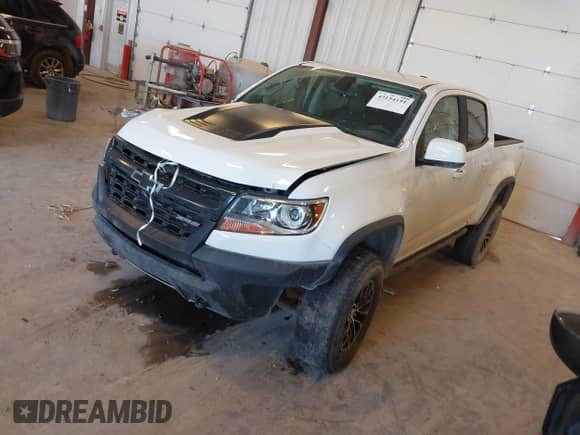 2018 Chevrolet Colorado 4WD ZR2 с VIN 1GCGTEEN6J1266870, выставлен на аукционе IAAI как лот 43154191 с пробегом 90 413 миль миль и . История ставок и продаж доступна на DreamBid. Изображение 2.