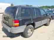 1996 Jeep Grand Cherokee Laredo z VIN 1J4GZ58SXTC280868, wystawiony jako IAAI lot #42653608 z przebiegiem 188 867 mil mil oraz . Historia ofert i sprzedaży dostępna na DreamBid. Obrazek 4.