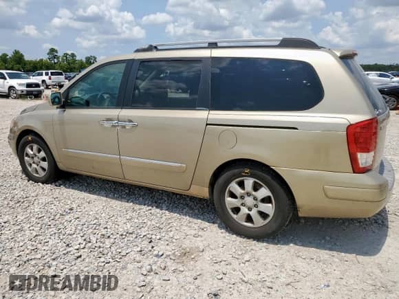 2007 Hyundai Entourage GLS with VIN KNDMC233376033298, listed as a Copart auction lot 68166895 with 154,725 mi miles and Salvage title. Bid and sale history available at DreamBid. Image 2.