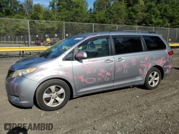 2011 Toyota Sienna LE with VIN 5TDKK3DC7BS089252, listed as a Copart auction lot 84197245 with 119,329 mi miles and Salvage title. Bid and sale history available at DreamBid. Image 1.