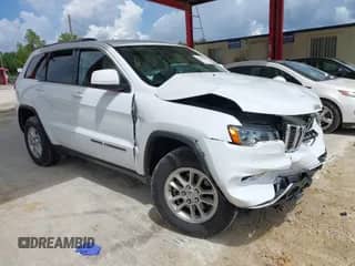 2020 Jeep Grand Cherokee Laredo E with VIN 1C4RJEAG5LC392277, listed as a IAAI auction lot 43310642 with 34,267 mi miles and . Bid and sale history available at DreamBid. Image 1.