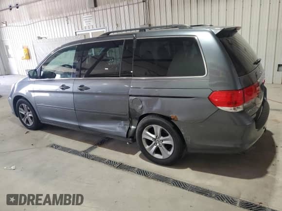 2010 Honda Odyssey Touring with VIN 5FNRL3H99AB018910, listed as a Copart auction lot 87198515 with 194,164 mi miles and Salvage title. Bid and sale history available at DreamBid. Image 2.