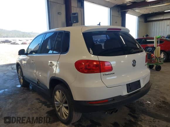 2013 Volkswagen Tiguan with VIN WVGCV3AX7DW605594, listed as a IAAI auction lot 42057457 with 131,629 mi miles and . Bid and sale history available at DreamBid. Image 3.