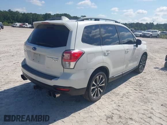 2017 Subaru Forester Touring z VIN JF2SJGWC6HH434017, wystawiony jako IAAI lot #42676511 z przebiegiem 110 981 mil mil oraz . Historia ofert i sprzedaży dostępna na DreamBid. Obrazek 4.