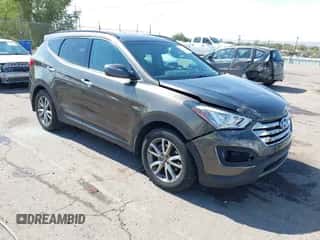 2014 Hyundai Santa Fe z VIN 5XYZU3LA4EG186807, wystawiony jako IAAI lot #43393062 z przebiegiem 67 944 mil mil oraz . Historia ofert i sprzedaży dostępna na DreamBid. Obrazek 1.