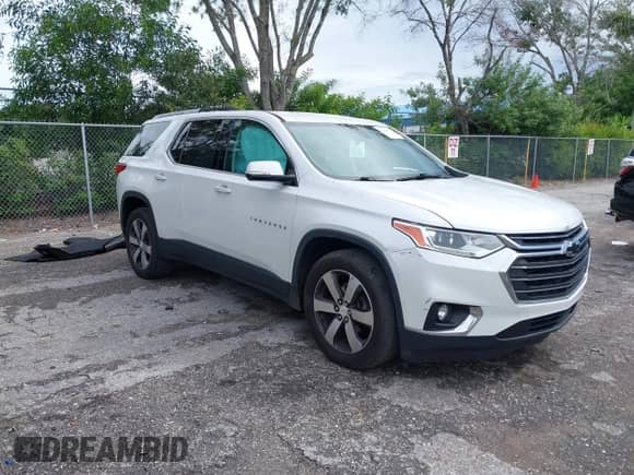 2018 Chevrolet Traverse LT z VIN 1GNERHKW6JJ149950, wystawiony jako IAAI lot #43249063 z przebiegiem 104 795 mil mil oraz . Historia ofert i sprzedaży dostępna na DreamBid. Obrazek 1.