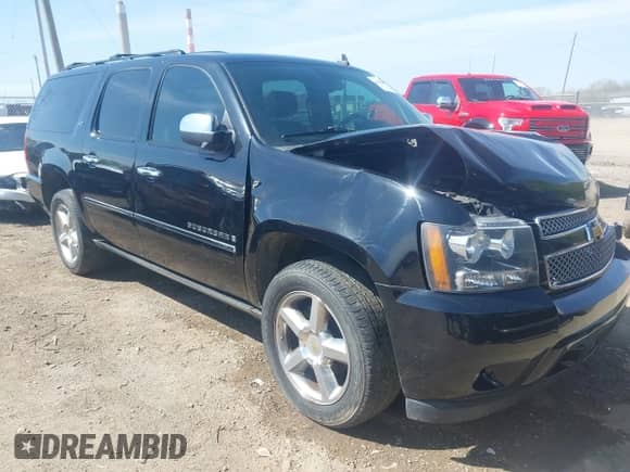 2009 Chevrolet Suburban LTZ z VIN 1GNFK36359R219818, wystawiony jako IAAI lot #42120323 z przebiegiem 146 999 mil mil oraz . Historia ofert i sprzedaży dostępna na DreamBid. Obrazek 1.
