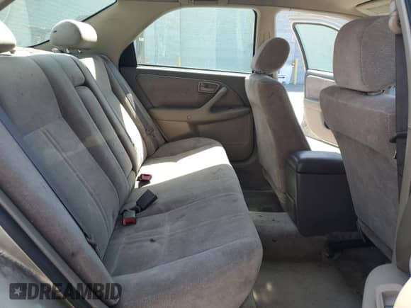 1997 Toyota Camry LE z VIN JT2BF22K5V0046585, wystawiony jako Copart lot #57061965 z przebiegiem Nie podano mil oraz Szkoda całkowita • Salvage title. Historia ofert i sprzedaży dostępna na DreamBid. Obrazek 10.