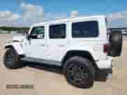 2021 Jeep Wrangler Unlimited Sahara High Altitude with VIN 1C4HJXENXMW509657, listed as a Copart auction lot 64983465 with 87,621 mi miles and Salvage title. Bid and sale history available at DreamBid. Image 2.