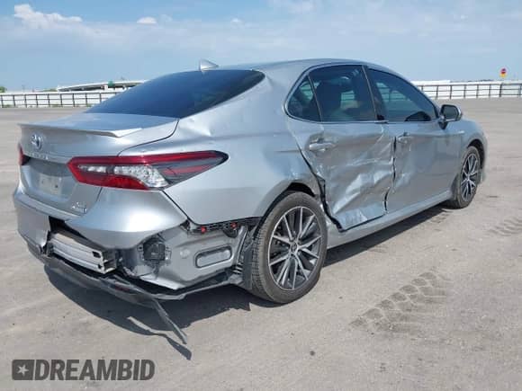 2021 Toyota Camry Hybrid XLE with VIN 4T1F31AK5MU565376, listed as a IAAI auction lot 42687616 with 57,880 mi miles and . Bid and sale history available at DreamBid. Image 4.