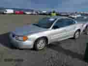 2001 Pontiac Grand Am SE1 with VIN 1G2NF52TX1M560650, listed as a IAAI auction lot 41654339 with 122,885 mi miles and . Bid and sale history available at DreamBid. Image 2.
