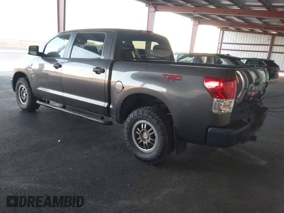2013 Toyota Tundra with VIN 5TFDY5F16DX271794, listed as a IAAI auction lot 43238875 with 257,659 mi miles and . Bid and sale history available at DreamBid. Image 3.