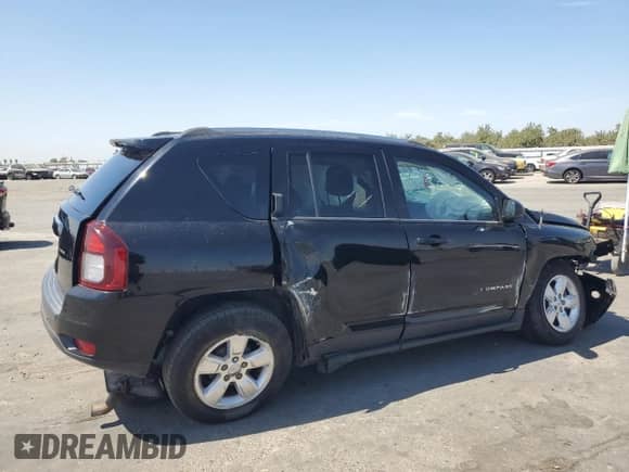 2014 Jeep Compass Sport with VIN 1C4NJCBA9ED925595, listed as a Copart auction lot 69980205 with 115,857 mi miles and Salvage title. Bid and sale history available at DreamBid. Image 3.