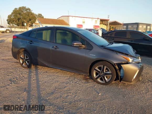 2022 Toyota Prius L Eco with VIN JTDKAMFU4N3175879, listed as a IAAI auction lot 43407344 with 15,599 mi miles and . Bid and sale history available at DreamBid. Image 1.