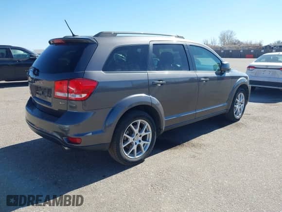 2014 Dodge Journey SXT with VIN 3C4PDDBG8ET214636, listed as a IAAI auction lot 41651140 with 141,742 mi miles and . Bid and sale history available at DreamBid. Image 4.