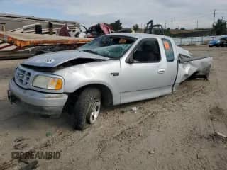 2002 Ford F-150 XL with VIN 1FTRX17252NB07504, listed as a Copart auction lot 80520035 with Not provided miles and Salvage title. Bid and sale history available at DreamBid. Image 1.