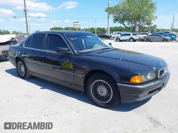 1997 BMW 7 Series 740i with VIN WBAGF8325VDL45398, listed as a IAAI auction lot 41910072 with 174,590 mi miles and . Bid and sale history available at DreamBid. Image 1.